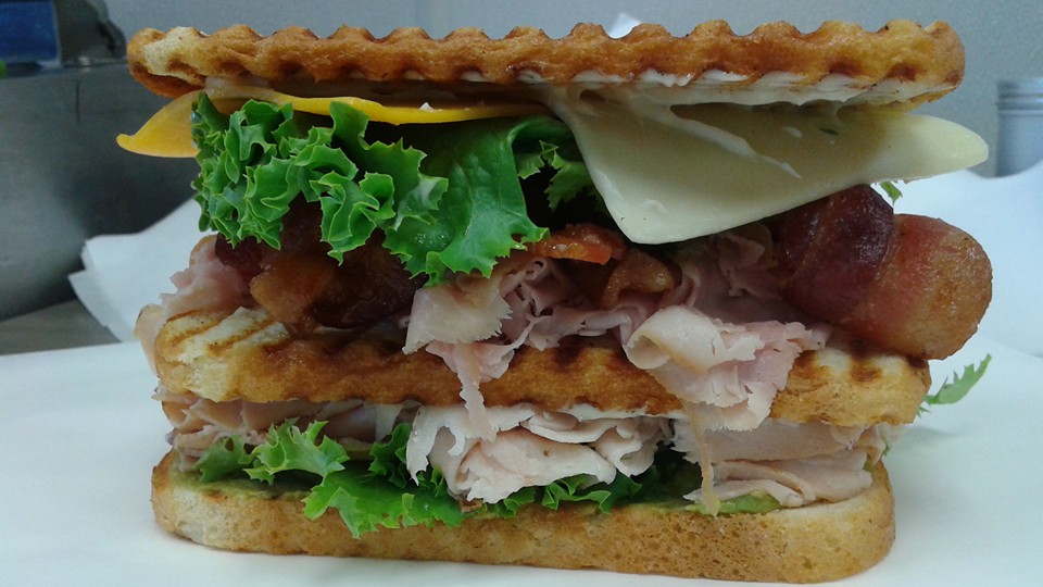 Club sandwich clubhouse sandwich on toasted bread sliced turkey bacon lettuce tomato mayonnaise 